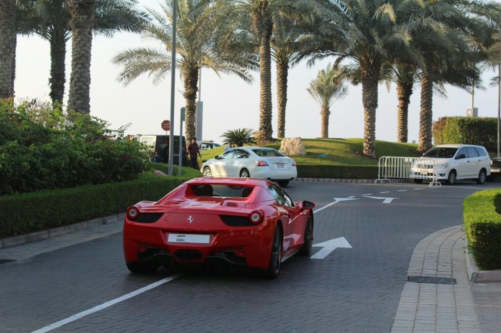a red sports car parked on the side of a road