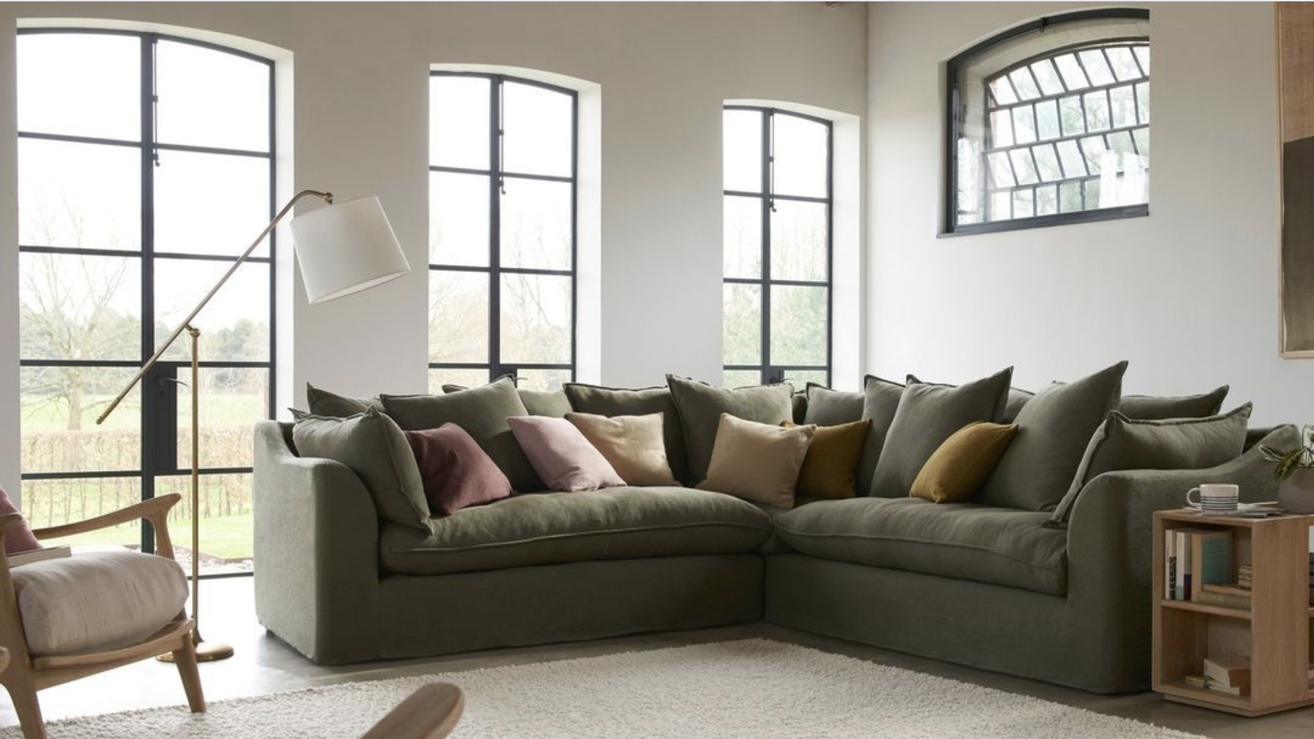 Deep Green Sectional with Light Wood Floor