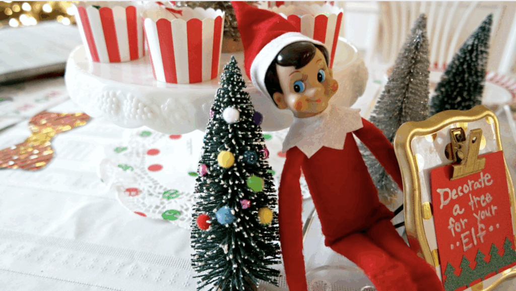 Elf Decorating a Small Christmas Tree