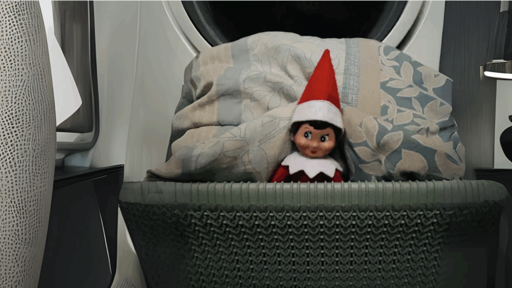 Elf Hiding Inside a Basket of Clothes