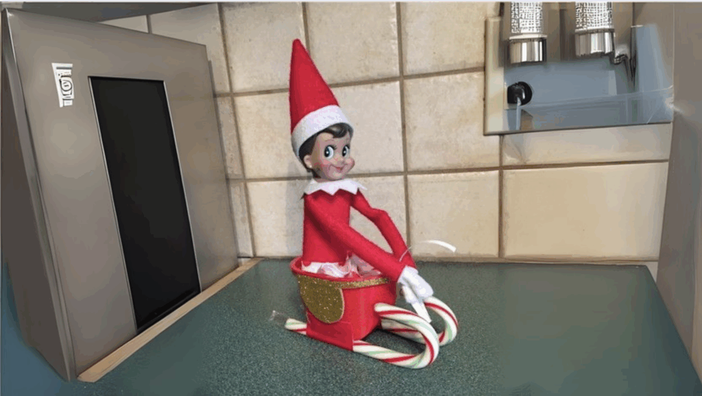 Elf Riding a Mini Sled