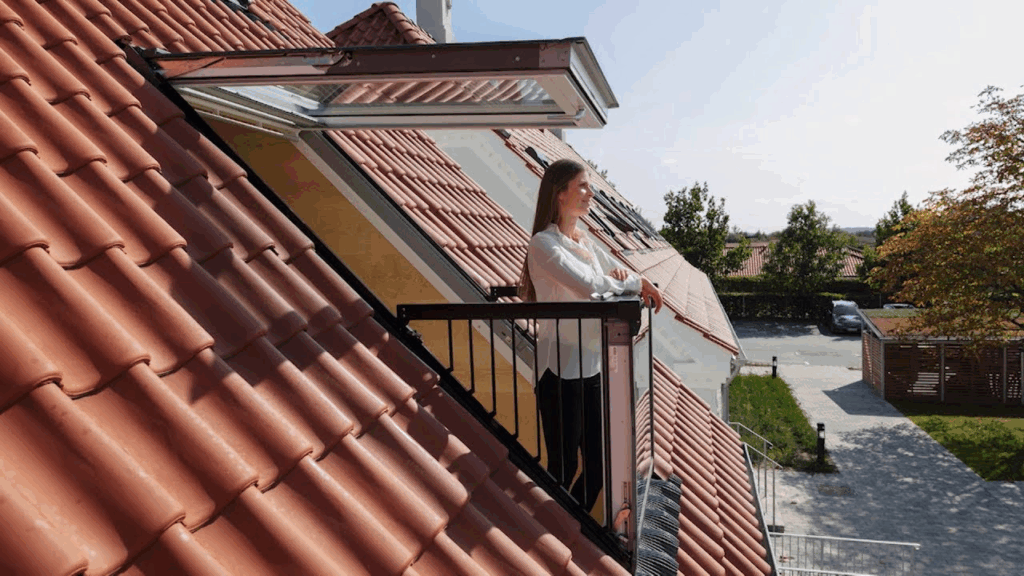 a girl standing on a open roof