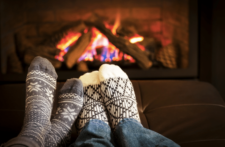 Feet of a couple sitting in winters