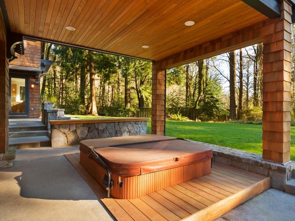Backyard hot tub on a patio ready for removal or replacement