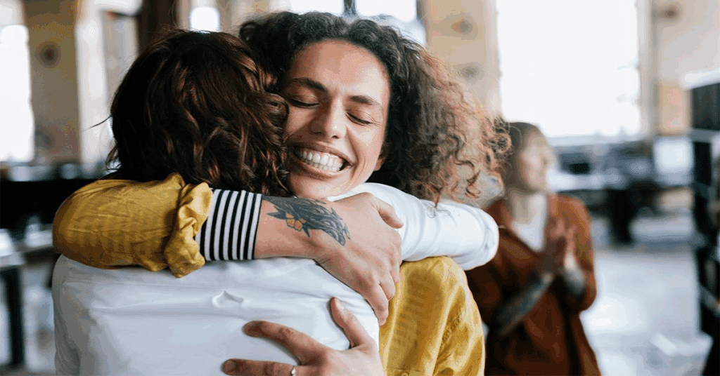 Two friends hugging each other