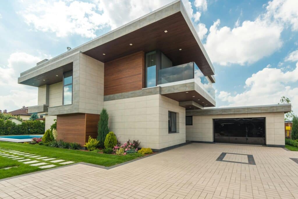 The Benefits of Pairing Concrete Walkways with Garden Landscaping