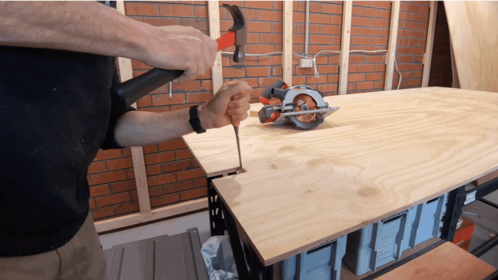 cut notches in the plywood sheets to clear joists