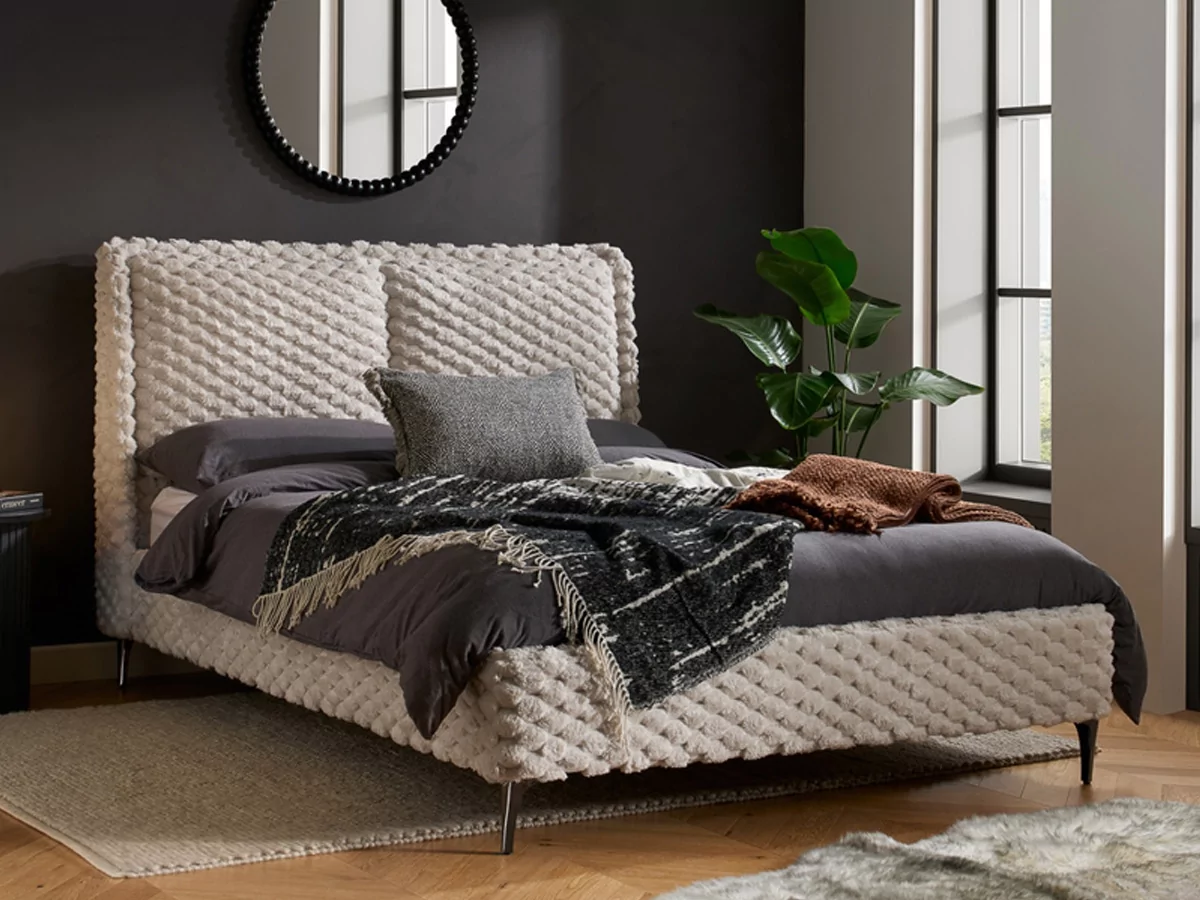 A bed with a round mirror

AI-generated content may be incorrect.