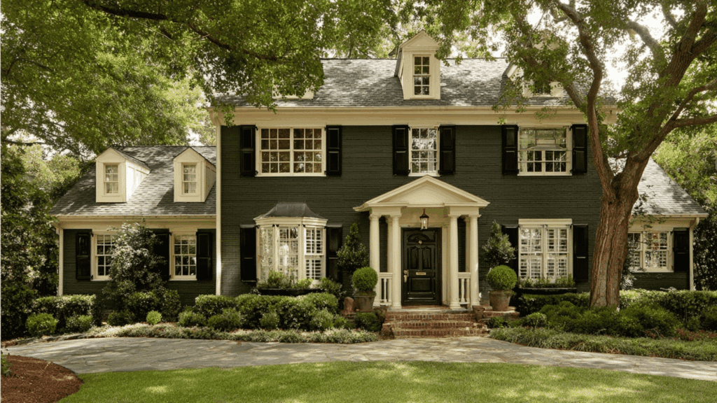 forest green siding cream trim black shutters