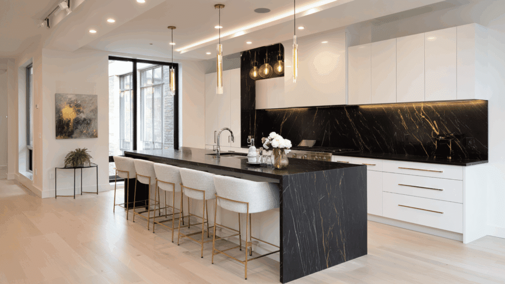 white cabinets with black quartz waterfall island