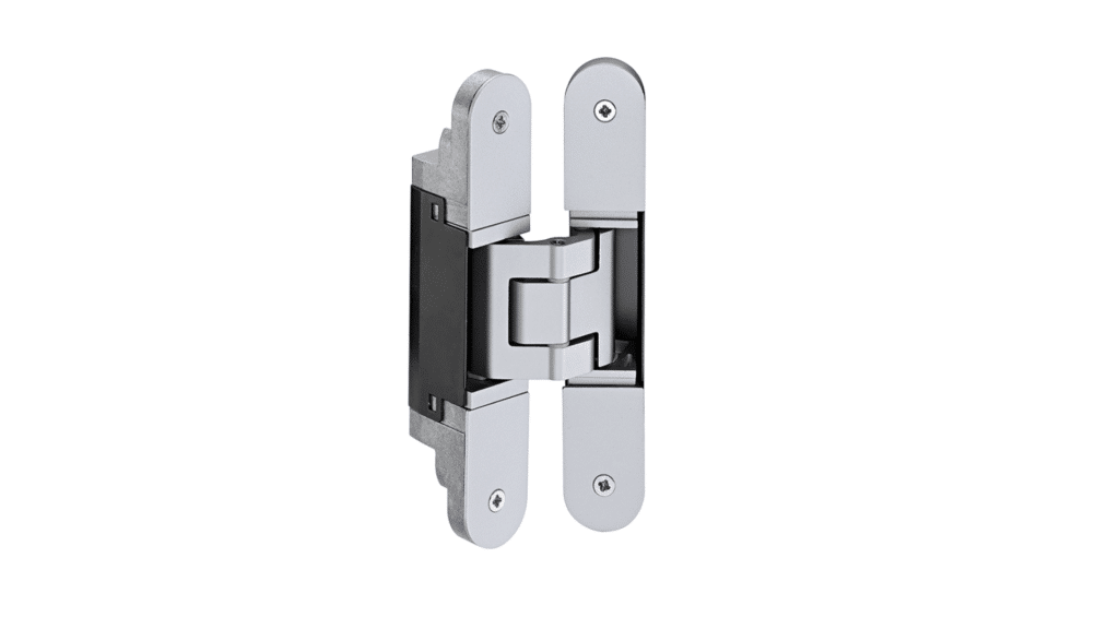A close-up, high-angle shot shows a concealed hinge against a white background.