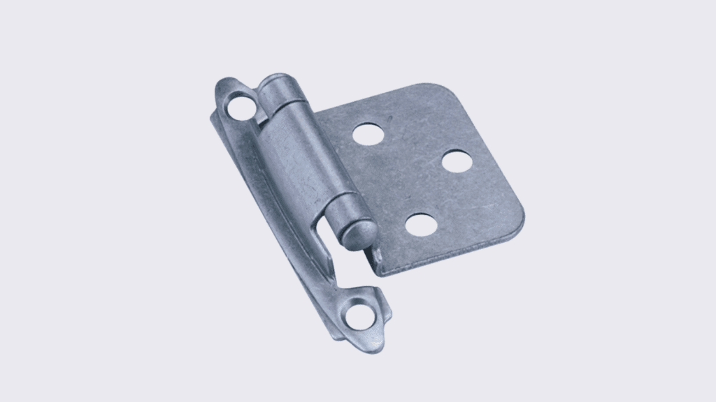 A close-up, high-angle shot shows a semi-concealed hinge against a plain white background