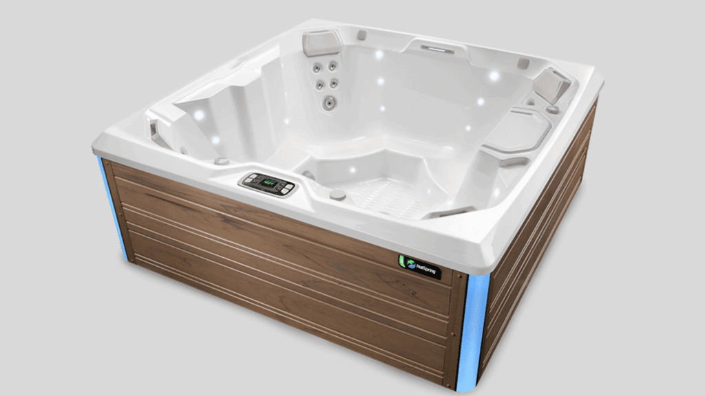 An HotSpring Limelight Flash hot tub against a light grey background.