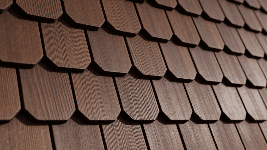 Dark brown, textured composite roofing shingles laid in overlapping courses receding into the distance.