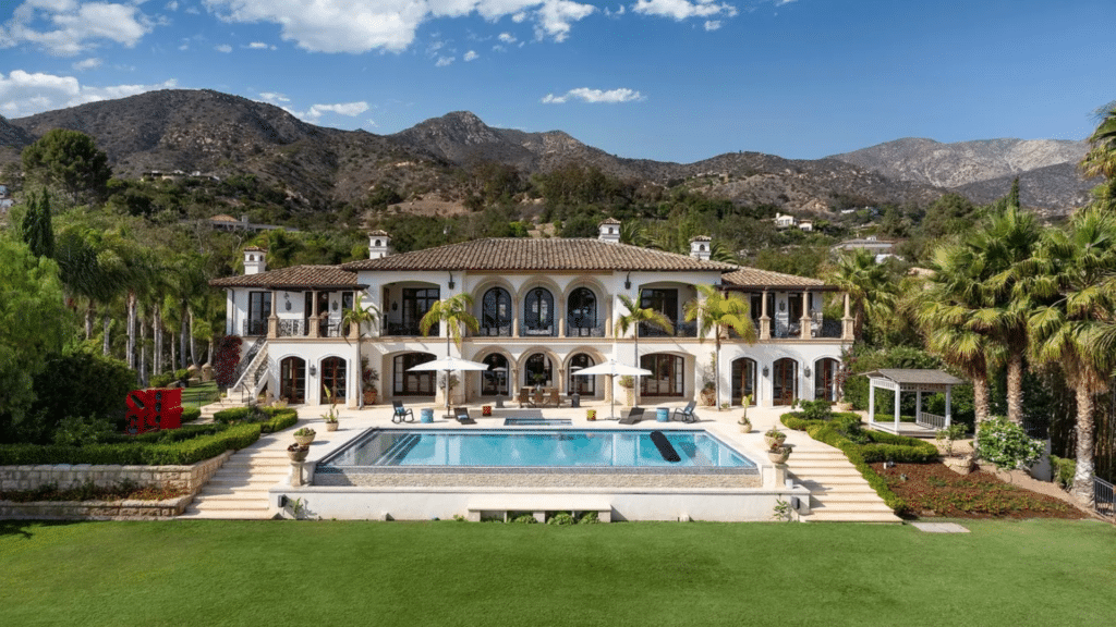 Front view of Prince Harry's Montecito Home with a pool and a garden