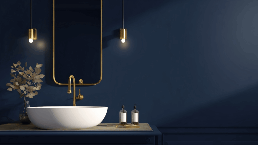 Navy blue bathroom paint with white sink and elegant gold accents