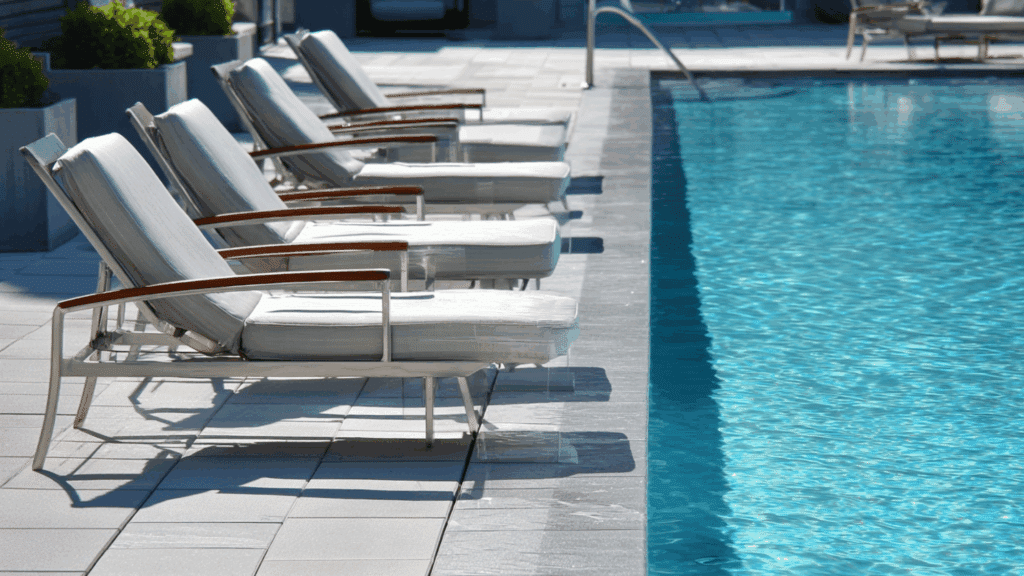 Poolside chairs placed safely away from water edge.