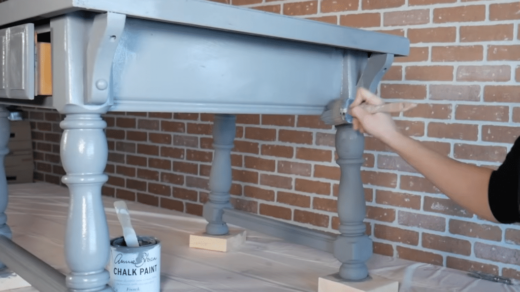 Applying second coat of chalk paint for full coverage