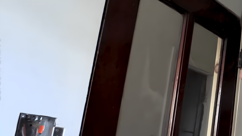 Choosing the correct side of a glass door panel before applying frosted spray paint