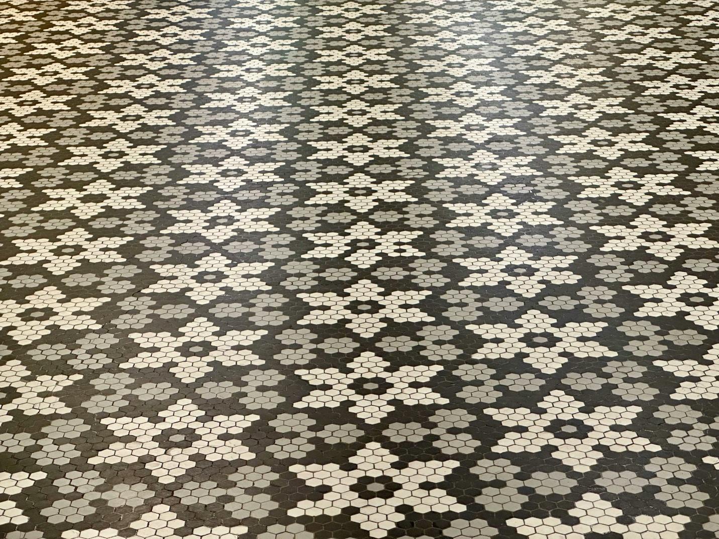 A black and white tiled floor
AI-generated content may be incorrect.