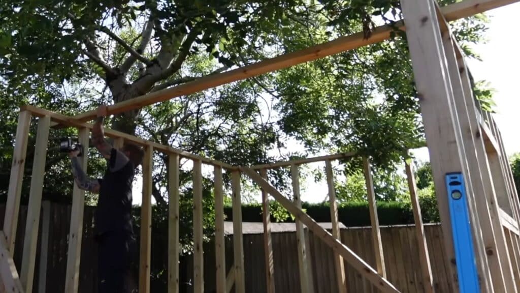 adding diagonal or horizontal braces to prevent movement and keep shed walls square
