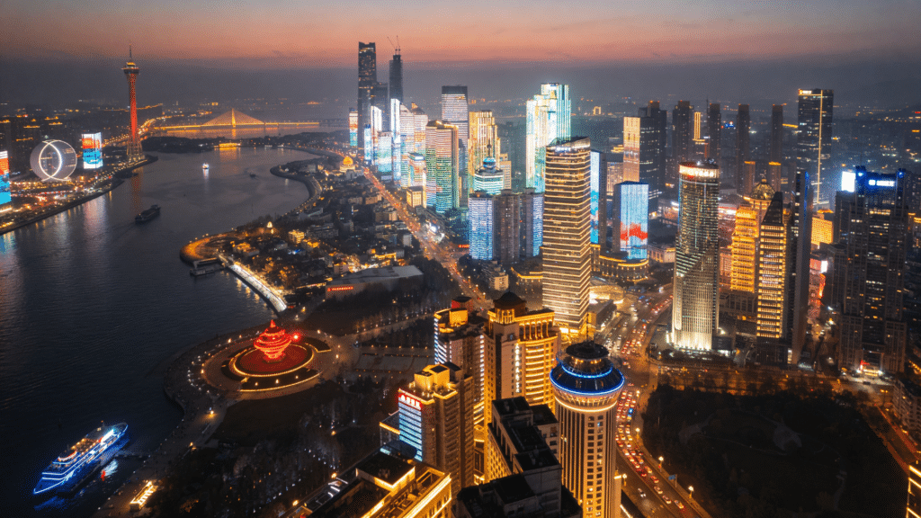 aerial view of modern chinese skyline with river and lights