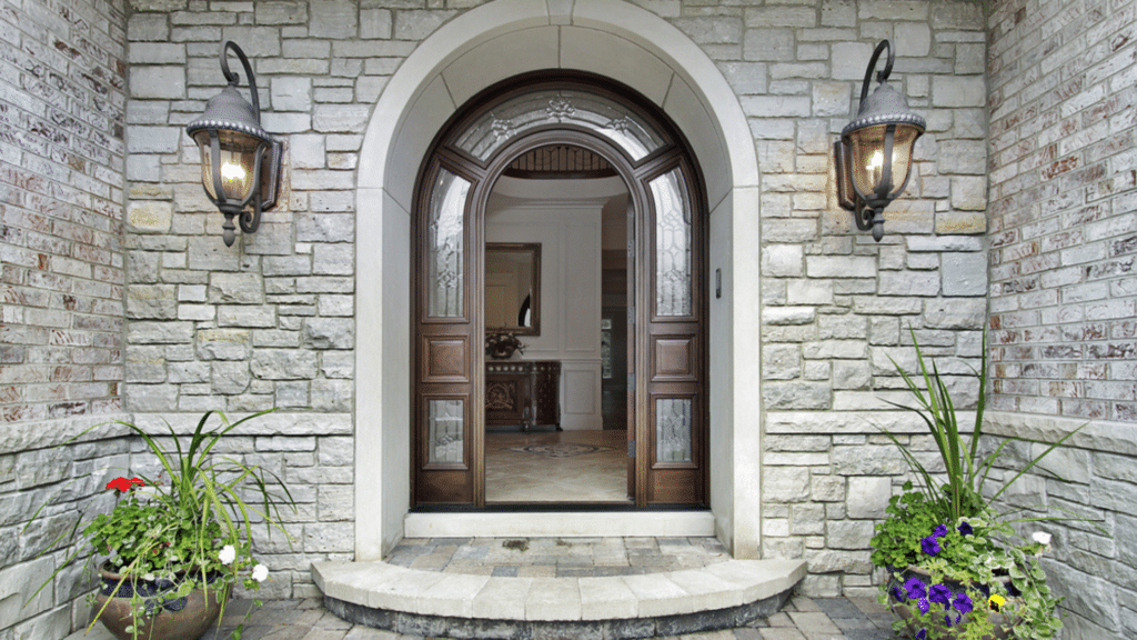 arched entrance doorway of traditional tudor cottage design