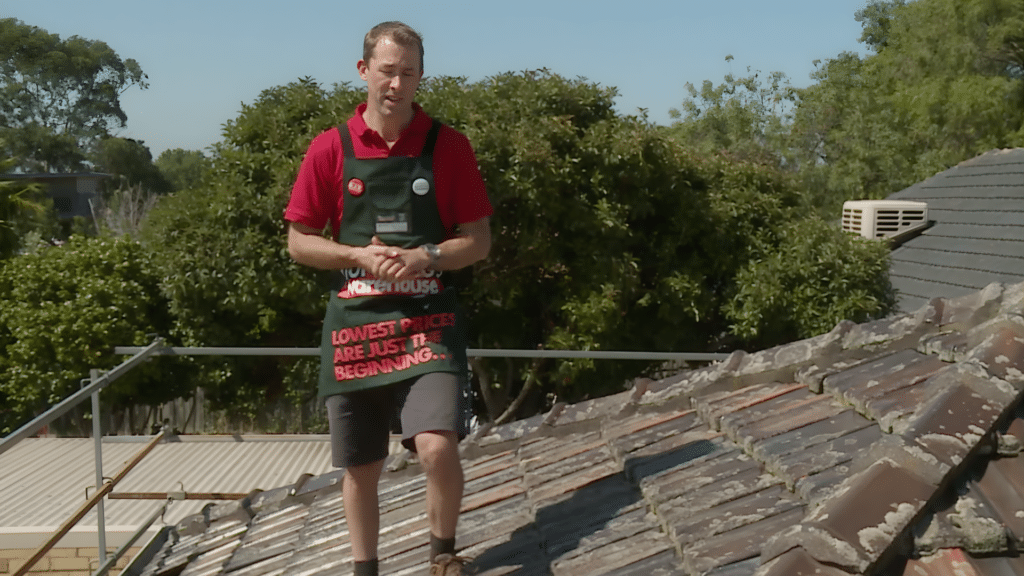 before tile roof cleaning safety checking with worker standing on roof inspecting surface stability and proper positioning