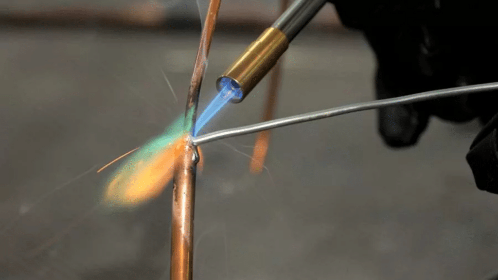 brazing copper pipes with torch and filler material
