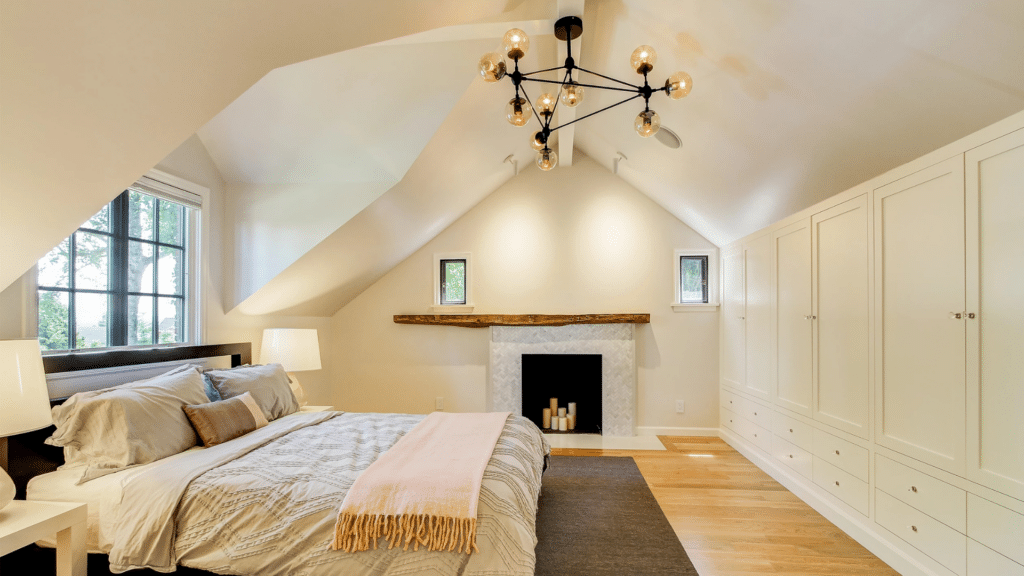 bright attic bedroom inside modern tudor cottage design