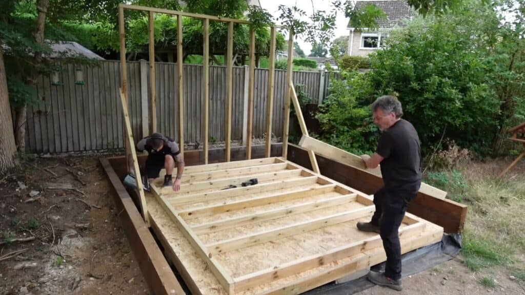 building and attaching side walls to complete the main shed structure and support frame