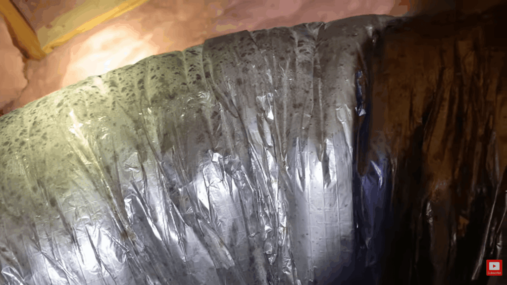 close view of mold growth on air duct insulation surface showing contamination and buildup related to how to remove mold from fabric
