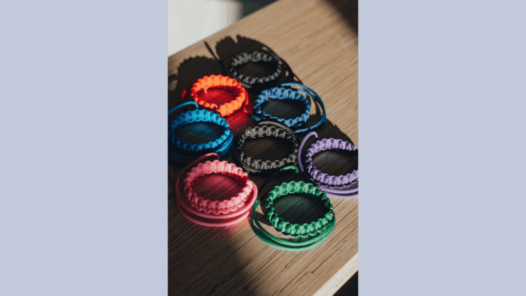 colorful diy friendship bracelets arranged on wooden table for valentine gift ideas