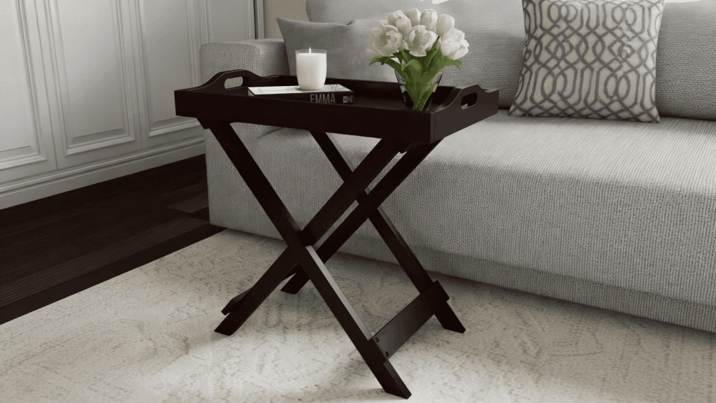 foldable end table with wooden frame placed beside sofa with book and cup for diy space saving idea