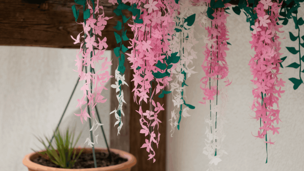 hanging wisteria made with pink white and green paper as part of flower crafts
