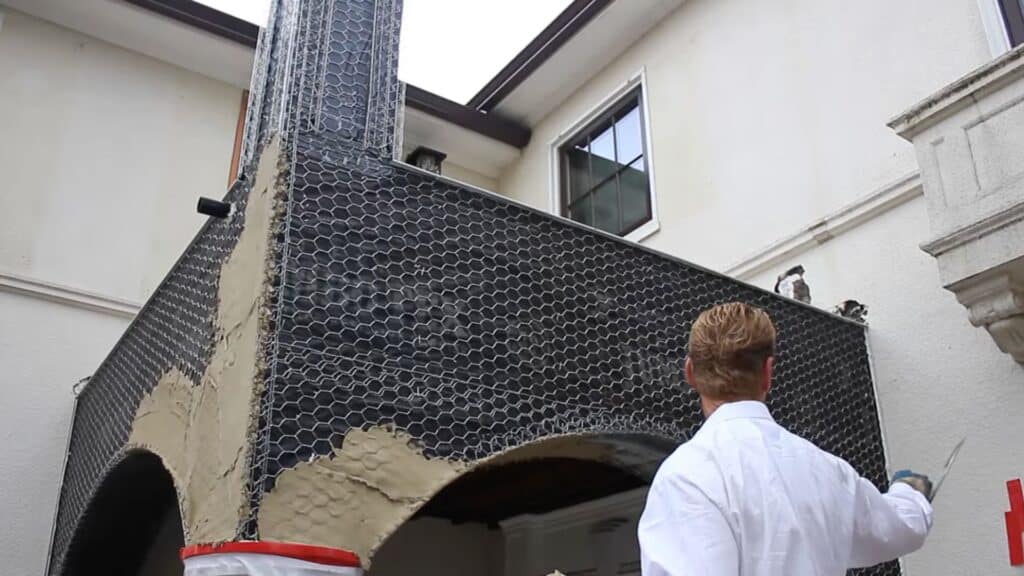 installing wire lath on soffit to prepare surface for stucco dash finish