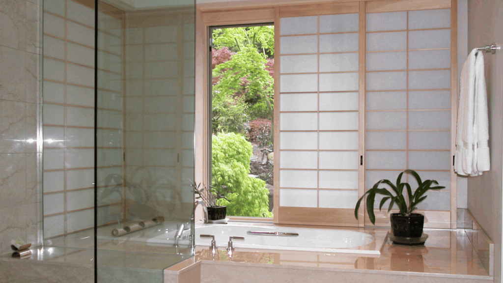 japanese bathroom design with soaking tub beside shoji screen window indoor plant and bright garden view minimal spa style interior