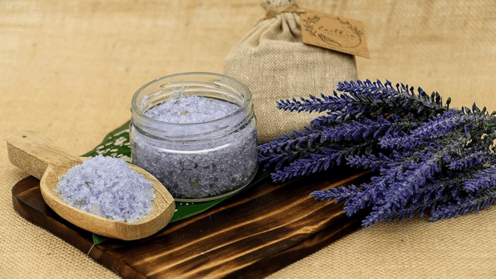 jar of lavender bath salt with wooden spoon and fresh lavender on board for homemade gifts made easy