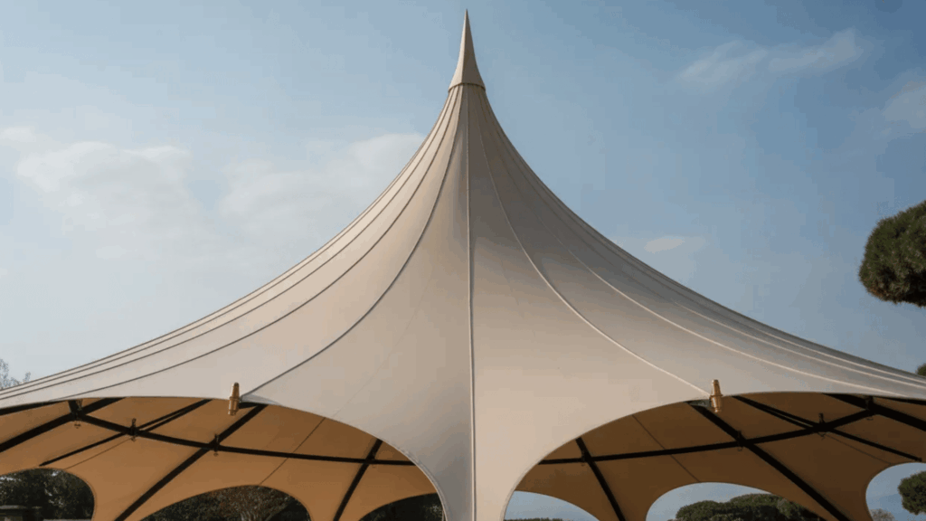 large tan tensile fabric canopy structure showcasing everything you need to know about roof styles