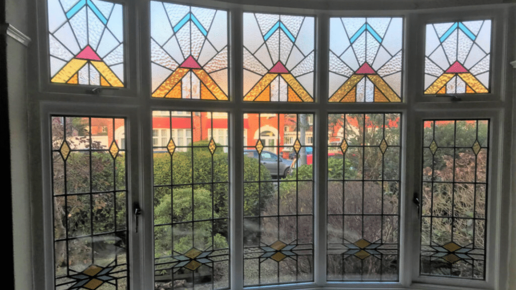 leaded glass windows in traditional tudor cottage