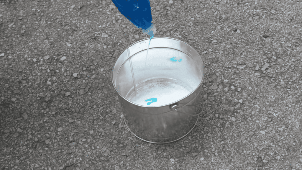 mixing borax and dish soap in water to create a simple cleaning solution for outdoor cushions