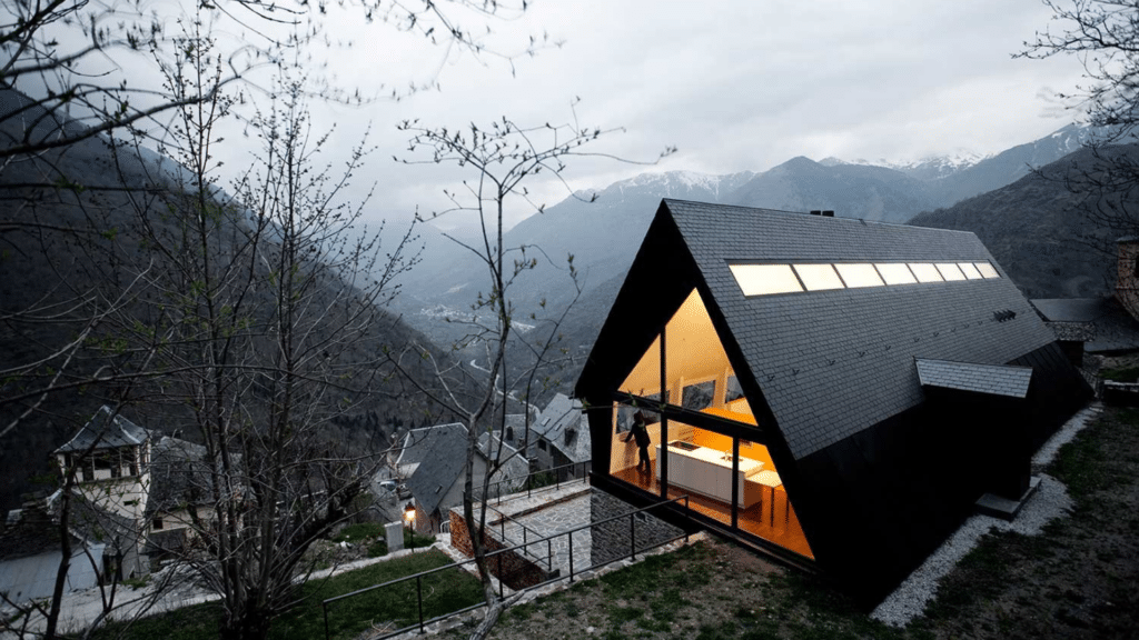 modern mountain tudor cottage with steep roof design