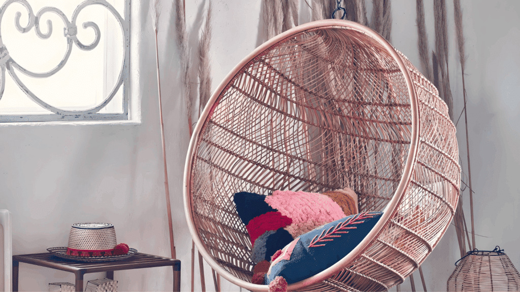 nostalgic 70s home interior ideas youll adore with hanging wicker egg chair colorful cushions soft sunlight and natural decor creating playful boho retro corner