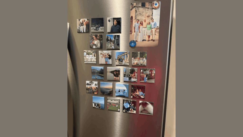 photos of family and friends pinned on a refrigerator with magnets