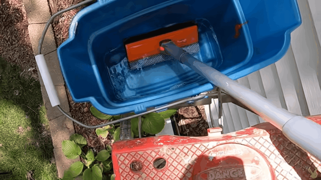 preparing solution for cleaning windows by squeezing foam showing cleaning windows with vinegar for shiny finish