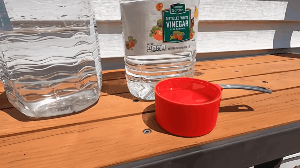 preparing solution for cleaning windows showing cleaning windows with vinegar for shiny finish