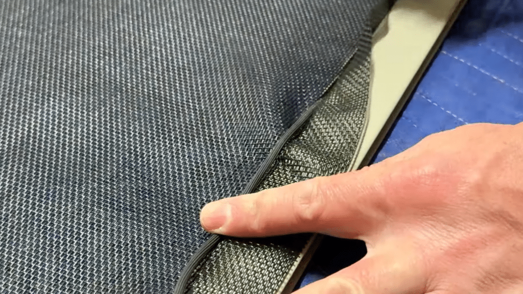 pull the mesh tight across frame and press spline into groove along sides to secure screen
