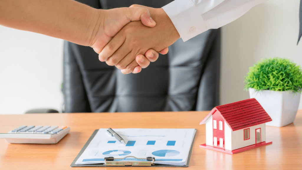 real estate broker closing the deal with house documents representing property deal agreement