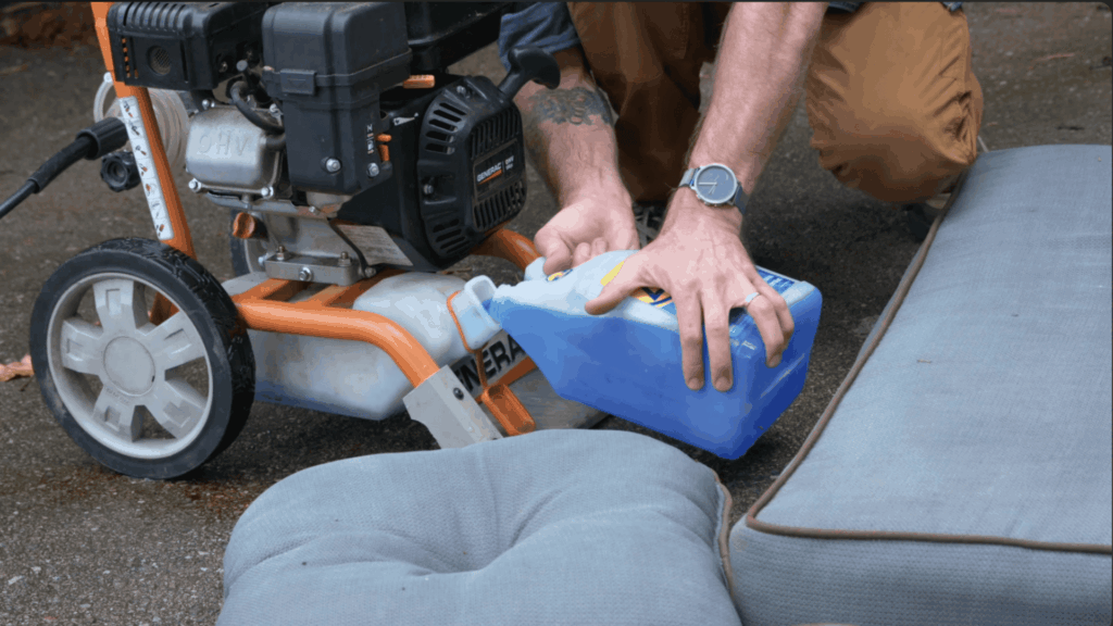 setting up a pressure washer with water and cleaning solution for faster cushion cleaning