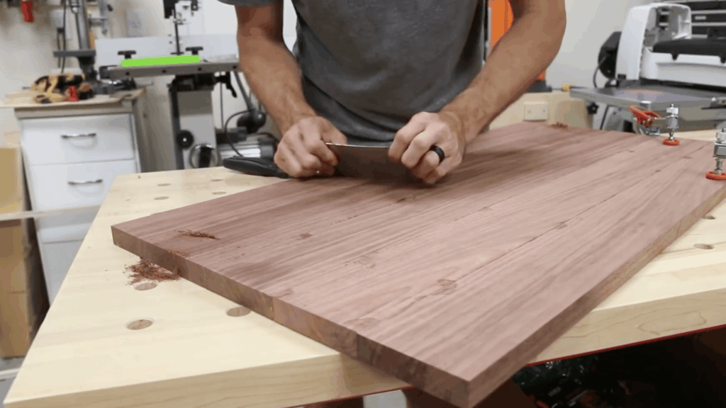 smoothing wood panel surface and preparing edges for accurate cutting and table assembly